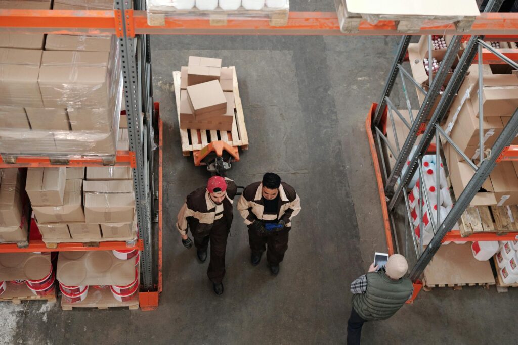 Men working in an import warehouse