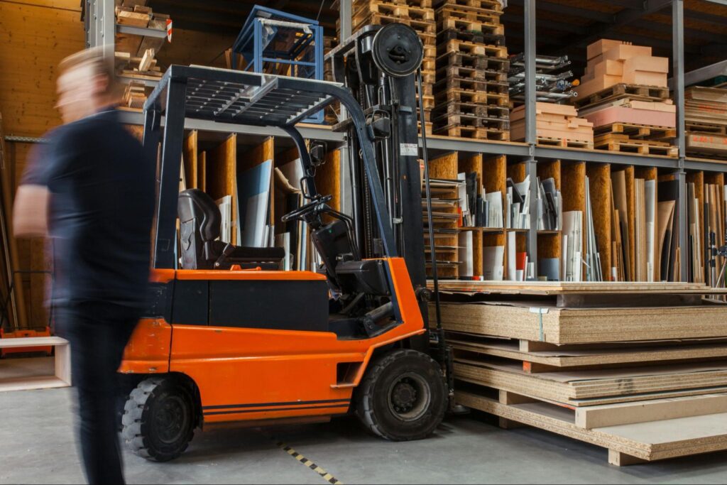 Forklift lifting several pallets