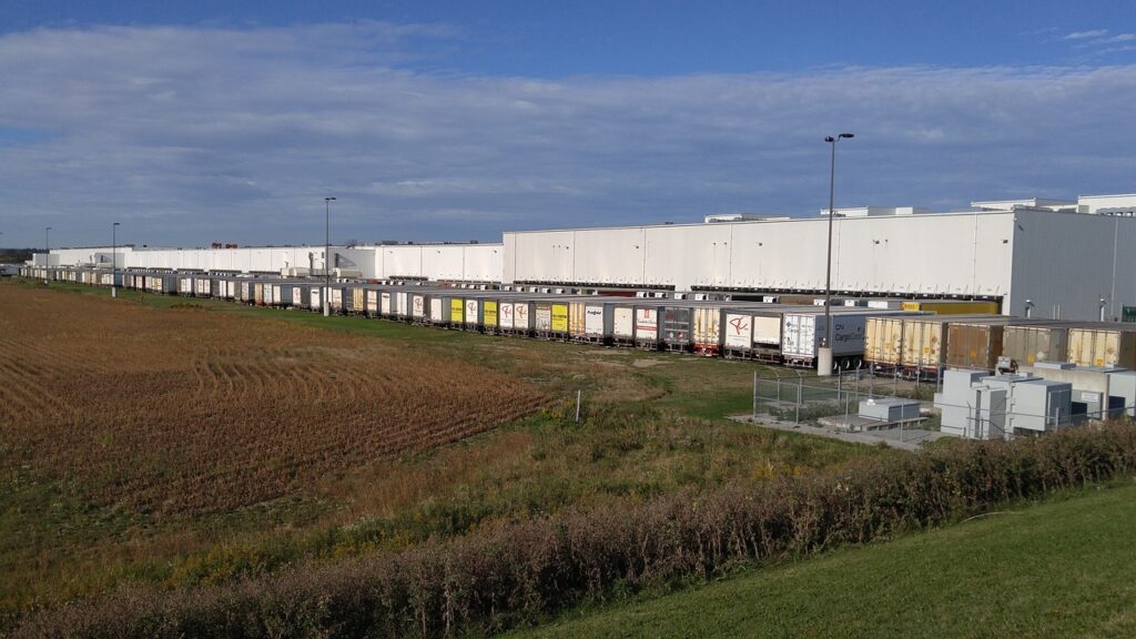 Trucks parked in the bays of a warehouse facility