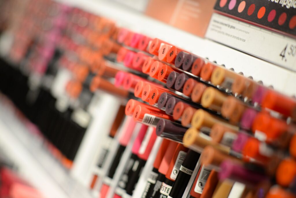 Lipsticks in multiple shades arranged for a beauty and cosmetics display.