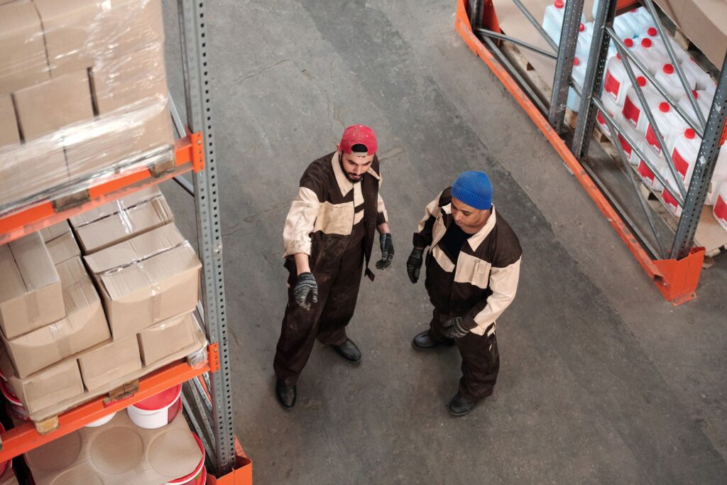 Two employees working in a 3PL cosmetics warehouse